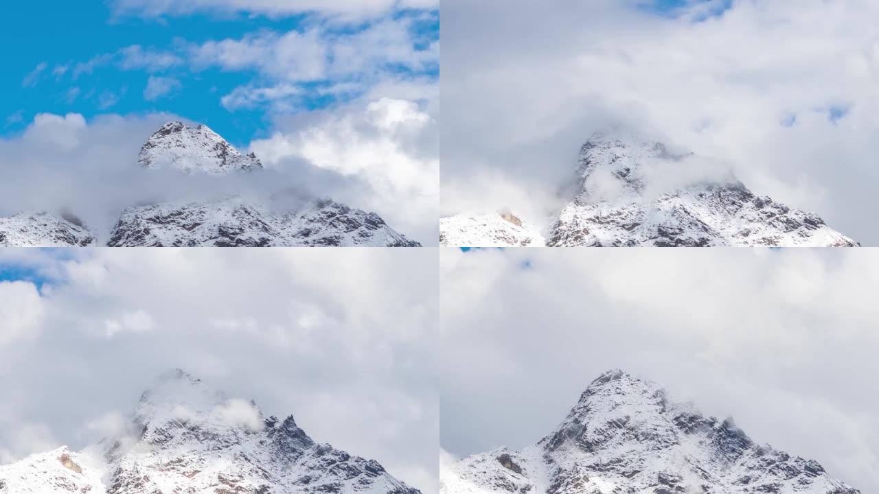 从印度喜马al尔邦Lahaul Spiti区的Keylong看到，积雪覆盖的山峰上方的云层延迟。白云