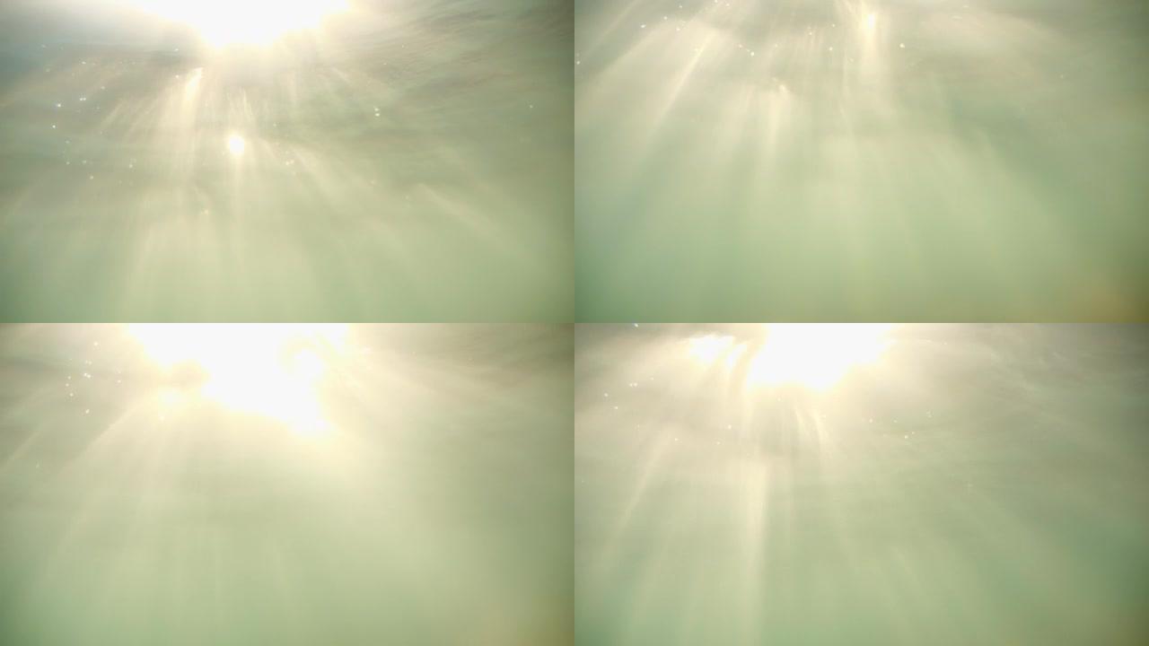 太阳的光线穿透了水面。水面上方耀眼的太阳。完美的背景。版本5