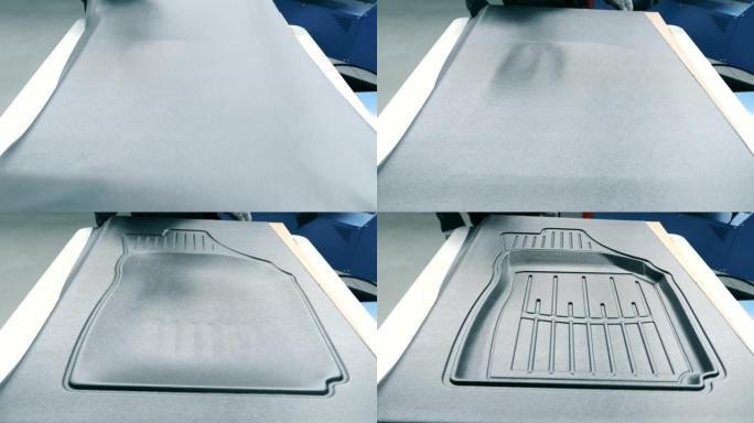 橡胶汽车脚垫的生产。压力机采用真空压缩的方法，形成了由宣纸制成的地毯的形状