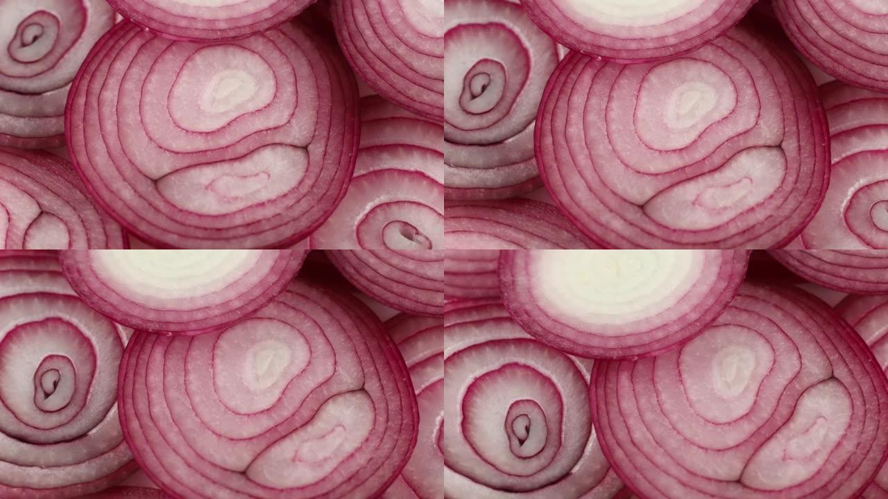 紫色洋葱切成环。食物背景模式。紫色洋葱背景或纹理。
