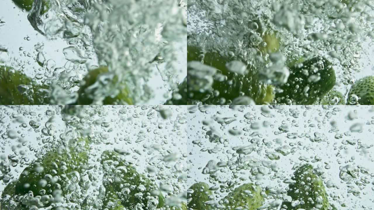 新鲜黄瓜落水特写。季节性花园蔬菜滴水
