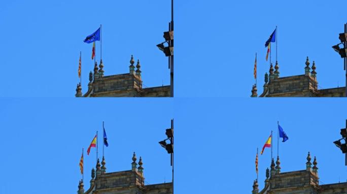 旗帜在巴塞罗那大楼的屋顶上飘扬——西班牙加泰罗尼亚，欧盟。高质量4k镜头