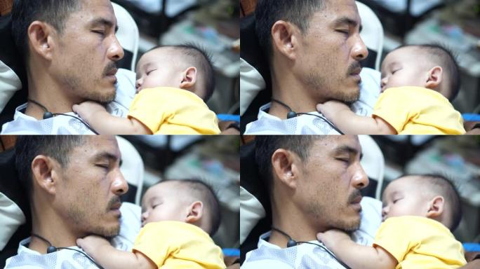 新生儿子睡在父亲的胸口