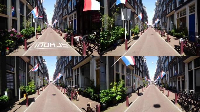 阿姆斯特丹和荷兰国旗的建筑。荷兰阿姆斯特丹美丽的街道，有典型的荷兰房屋。荷兰的旧中心区和传统建筑。阿
