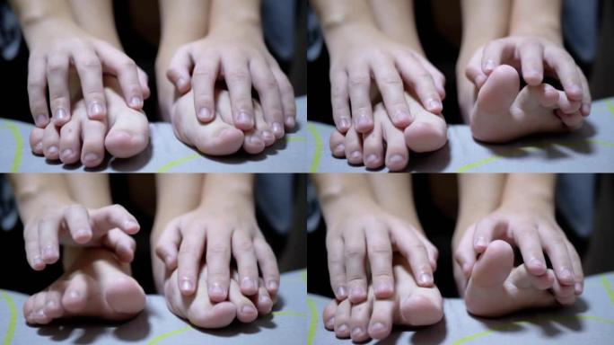 儿童手按摩皮肤脚趾和小手指。特写。自我按摩