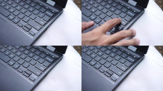 用食指按笔记本电脑键盘上的enter键。
