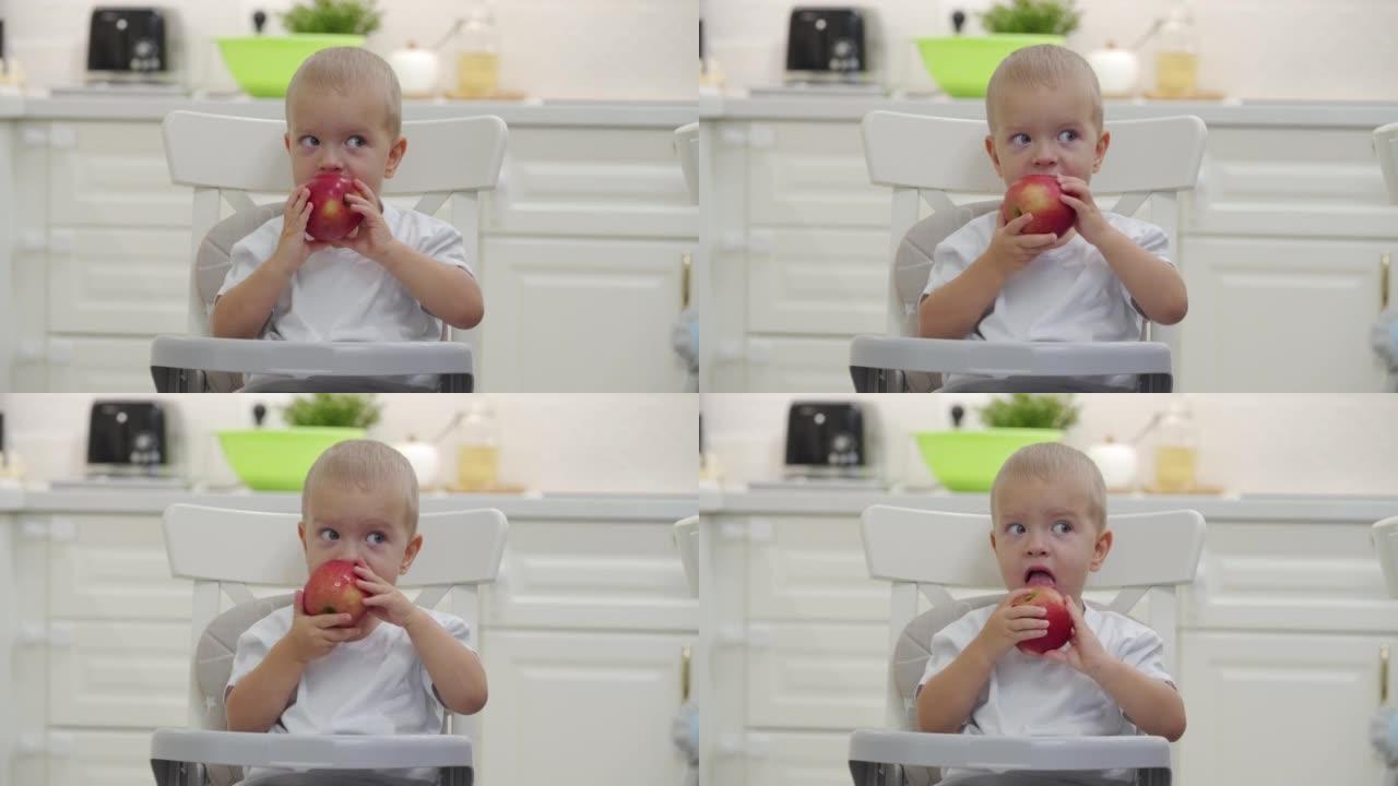 正在吃红苹果的小孩