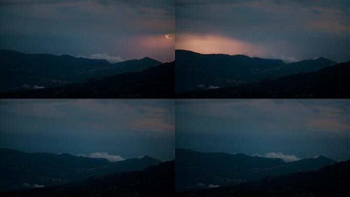 史诗般的山日落景观，地平线上有雷暴闪电