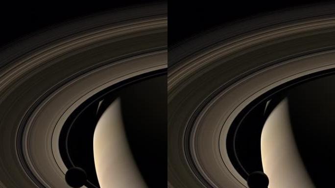 月球围绕土星行星和她在外层空间的环运行。4k垂直