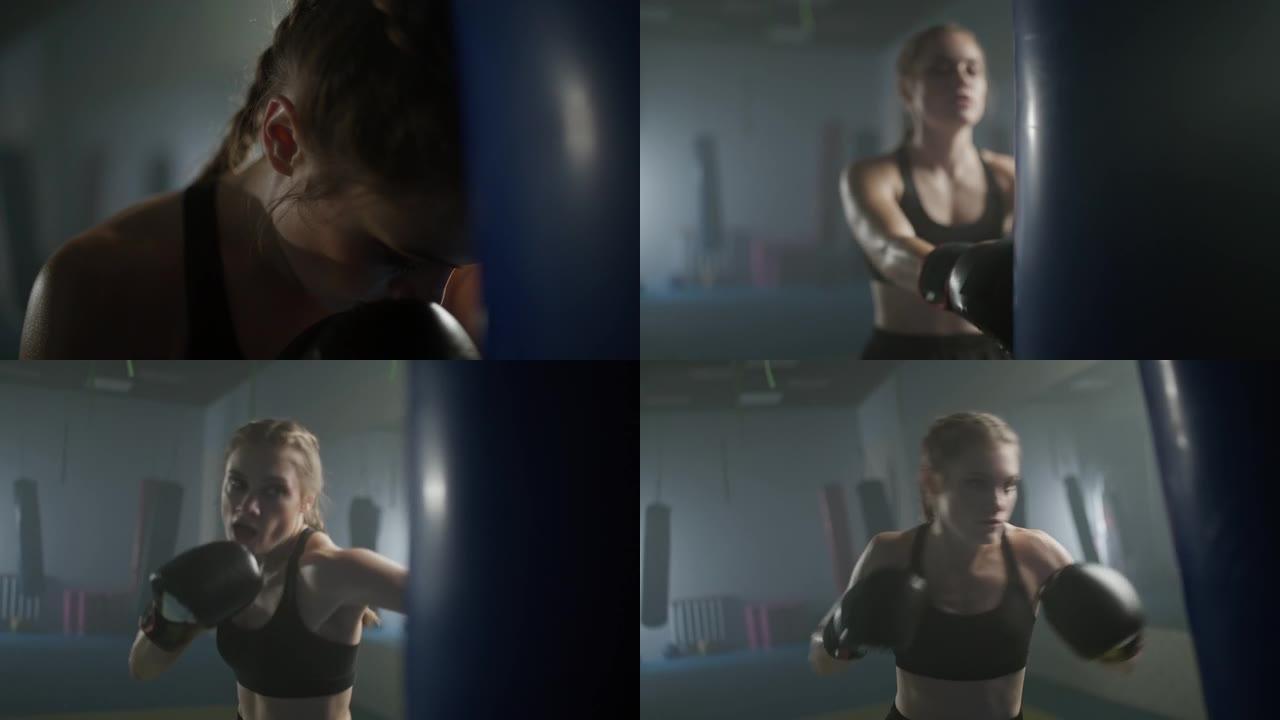 女人的力量，疲惫的女战士训练他的拳头，击败一个出气筒，在拳击馆训练一天，4k慢动作。