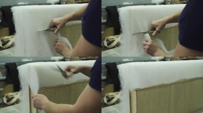 软垫家具的组装过程-切割泡沫橡胶。
