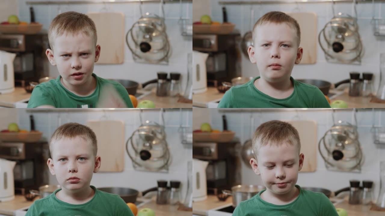 高加索男孩生气，紧张，在厨房的相机前挥手。
