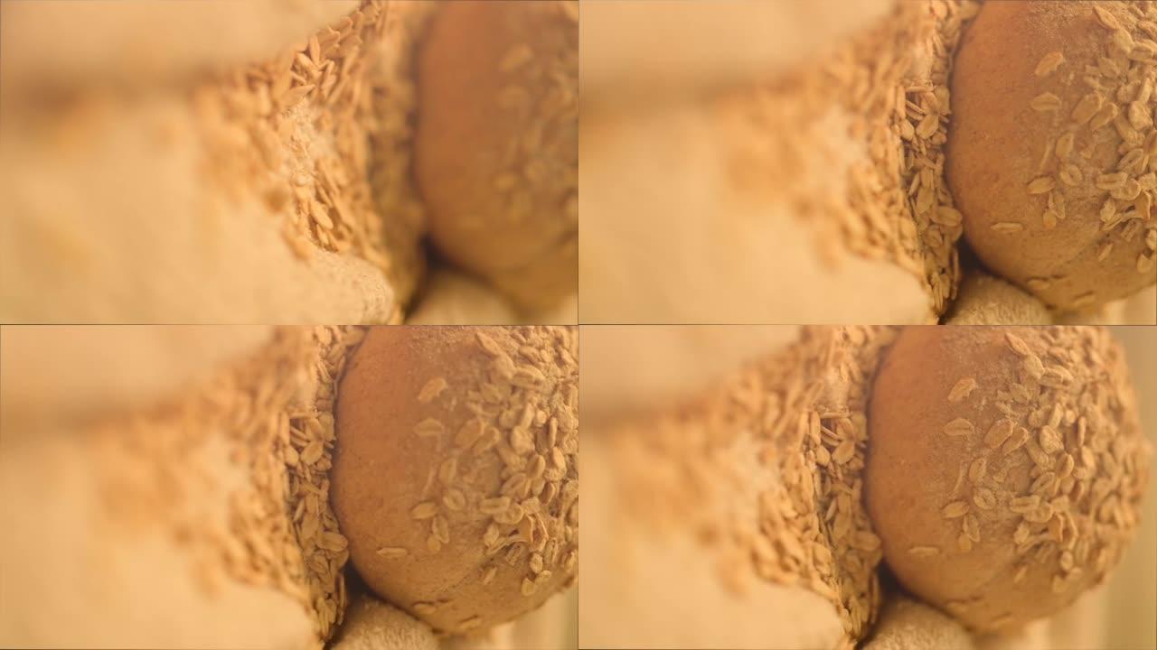 在粗麻布上盖有谷物种子的面包面包的特写高清镜头