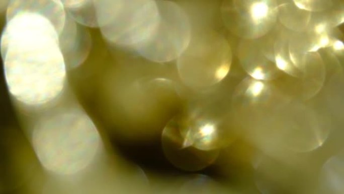 闪闪发光的抽象金色波克背景。模糊抽象仙女灯或蜡烛灯背景与bokeh
