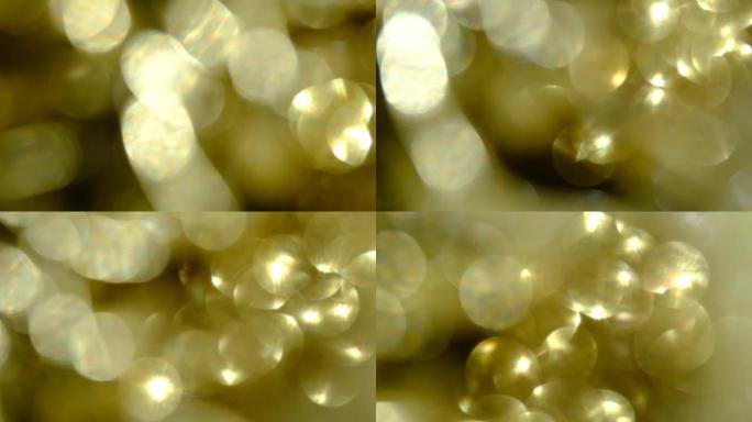 闪闪发光的抽象金色波克背景。模糊抽象仙女灯或蜡烛灯背景与bokeh
