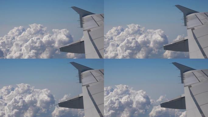 白天白色蓬松云飞行飞机机翼乘客窗视点全景4k