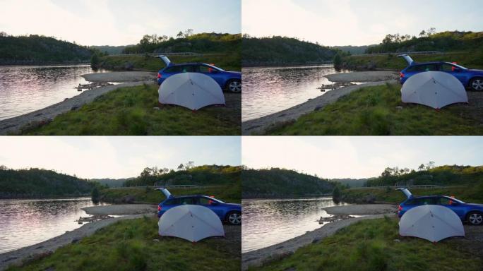 挪威湖边的帐篷和汽车