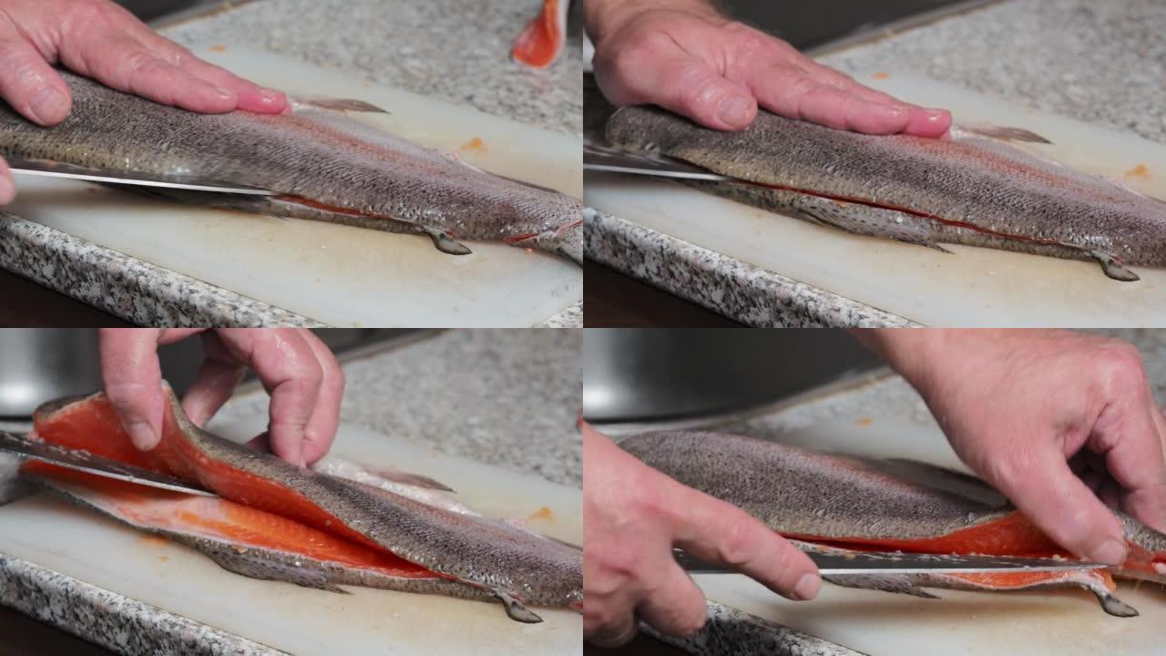 切开鱼鳟鱼的过程。在家做饭。