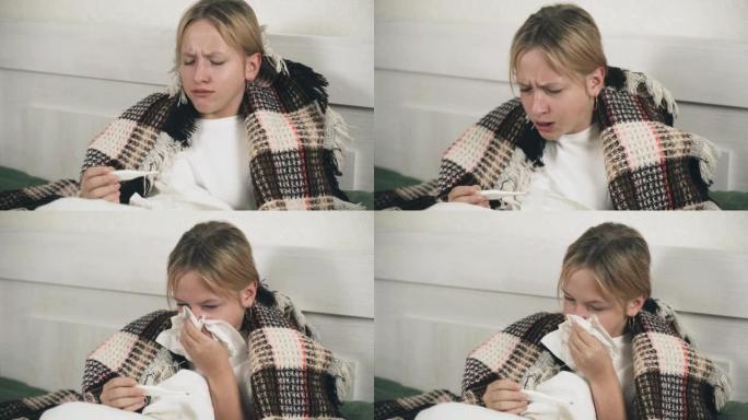 一个生病的女孩坐在铺着毯子的床上，咳嗽，吹鼻子，量体温。