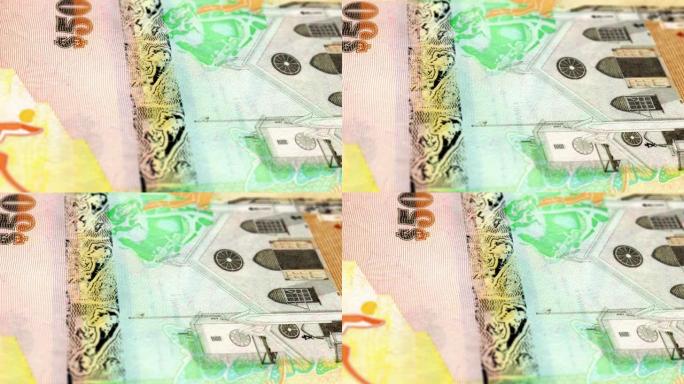 百慕大百慕大元50纸币，五十百慕大元，百慕大元的特写和宏观视图，跟踪和多莉拍摄50百慕大元纸币观察和