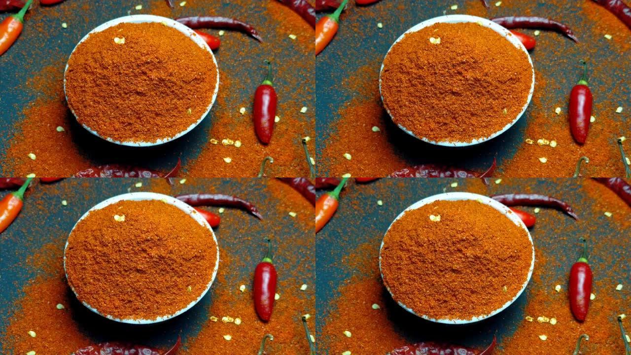 茶碗中的红色辣椒粉和辣椒纸录像。混合辣椒纸和辣椒纸粉。