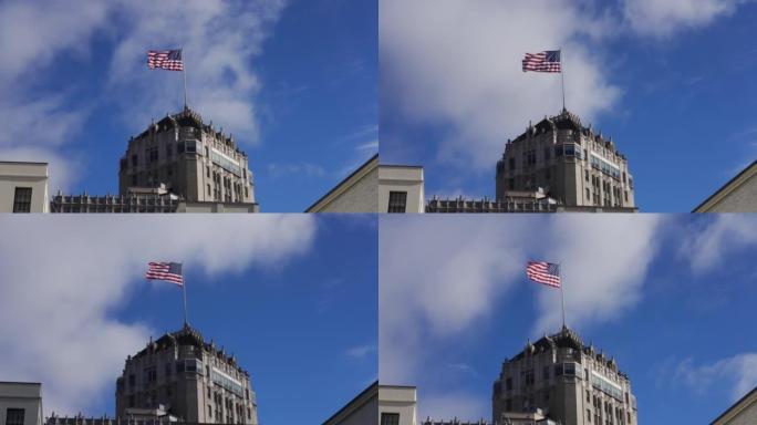 在建筑物上方盖有美国国旗的建筑物上拍摄的云彩