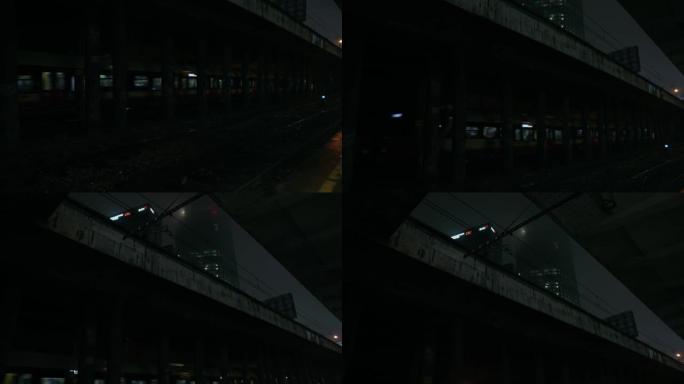 废弃的铁路/地铁站台。犹太人区。夜市阴雨秋雾天气。哥谭市情绪。电影风格。雾中的摩天大楼。