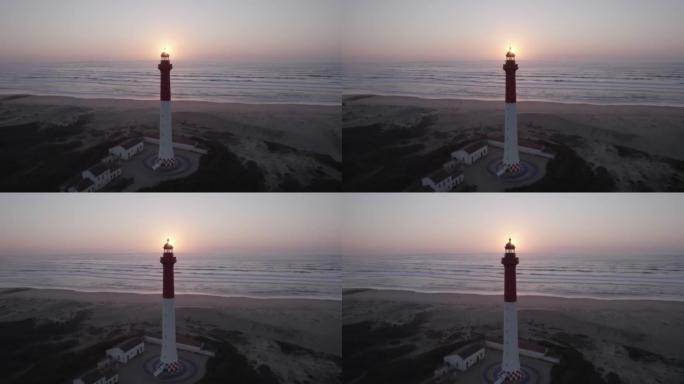 在法国滨海夏朗德省的夕阳下，拉库伯灯塔的空中多莉镜头
