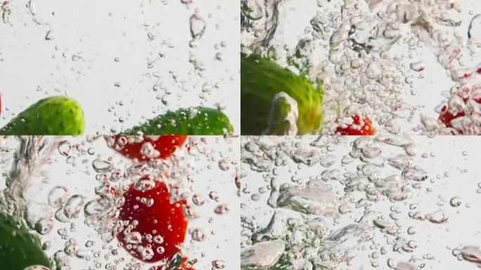 新鲜蔬菜落水在气泡特写。新鲜五颜六色的黄瓜