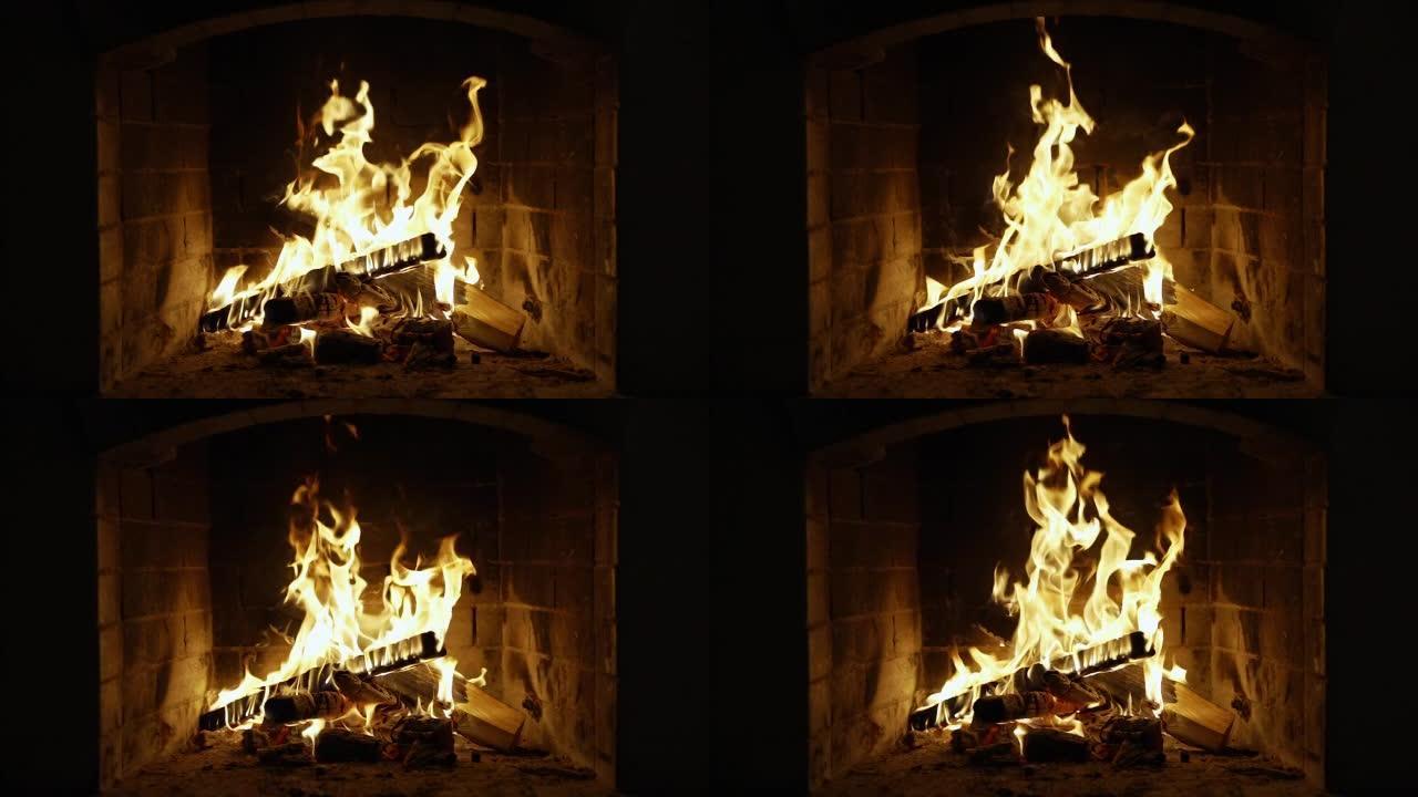 壁炉里燃烧着火。慢动作。带有中等大小火焰的壁炉的循环夹。