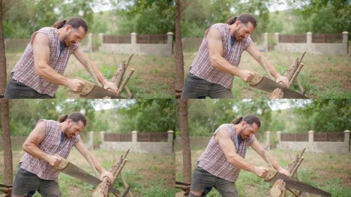 强壮的樵夫在花园里锯木头