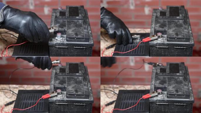 使用鳄鱼夹将汽车电池连接到充电器。