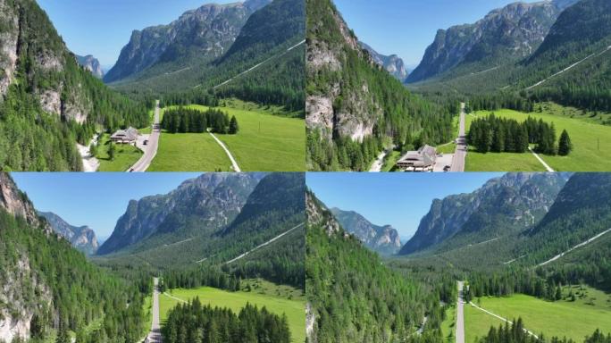 在意大利多洛米蒂山脉和交通道路的镜头上飞行的空中无人机视图。白云岩山脉，白云岩阿尔卑斯山或白云岩阿尔