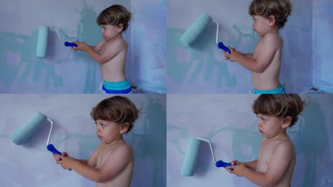 带油漆滚筒的儿童粉刷墙。可爱的小男孩用设备画画。孩子帮助父母进行房屋翻新