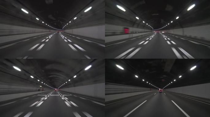 开车穿过高速公路隧道。