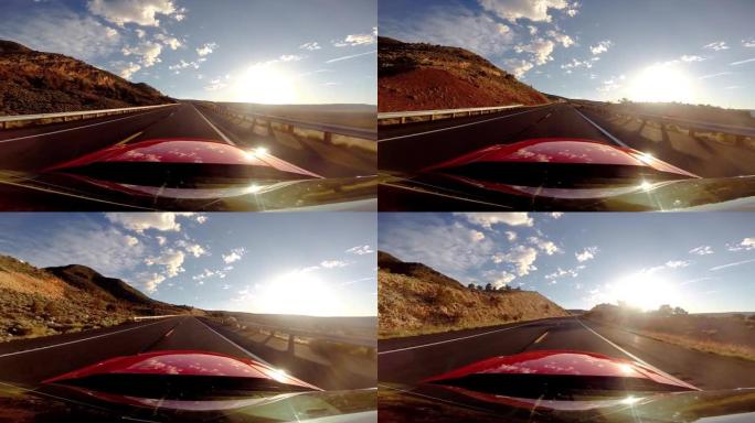 高清中一辆红色汽车在空旷的道路上行驶的特写视图