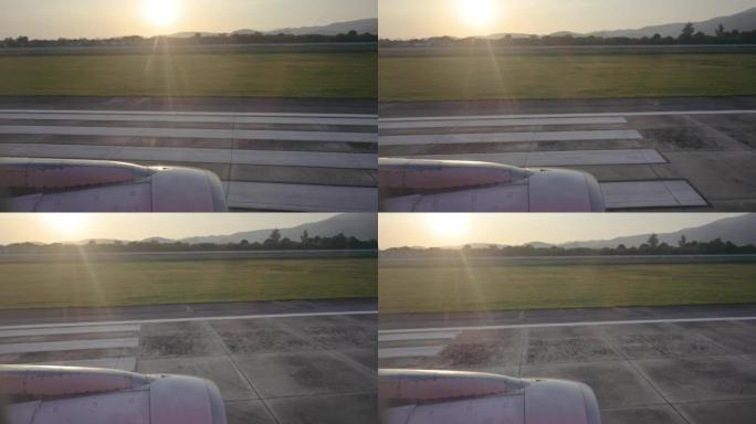 空中飞行飞机从泰国清迈国际机场起飞的宽日落视野