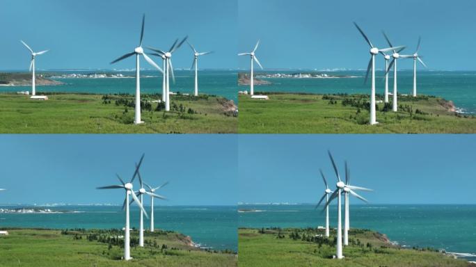 从鸟瞰图中可以看到巨大的风力涡轮机矗立在澎湖海滨公园的绿野上。