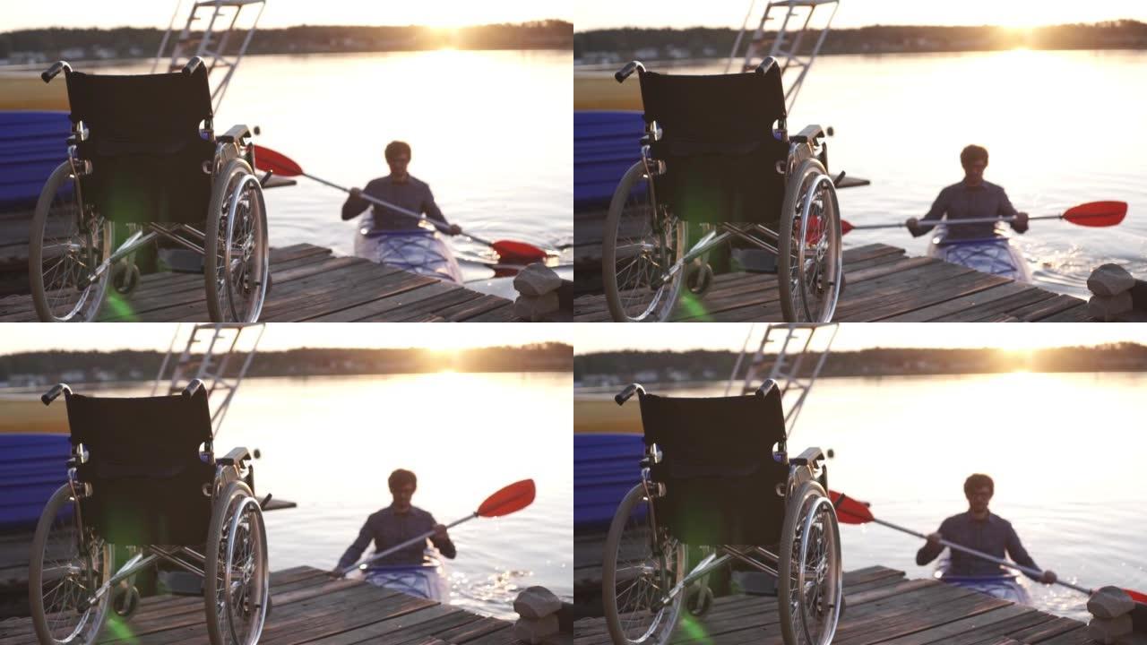 一名残疾男子在金色日落的背景下划独木舟。统一与自然的和谐