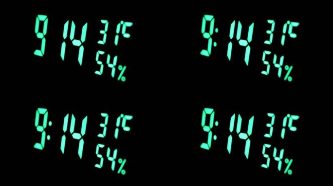 数字时钟在绿色显示上午9:14上显示时间、温度、空气湿度