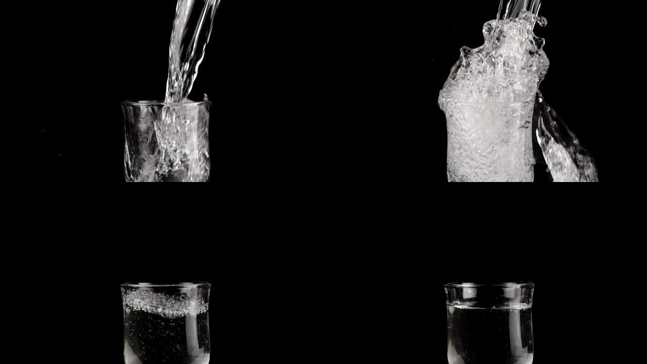 一股水被倒入黑色背景上的玻璃酒杯中，并产生飞溅的水。慢动作。