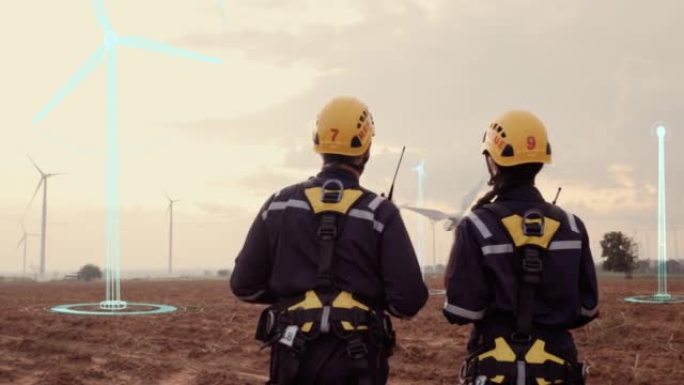 两位工程师在风力涡轮机发电站中寻找未来技术的数字效果