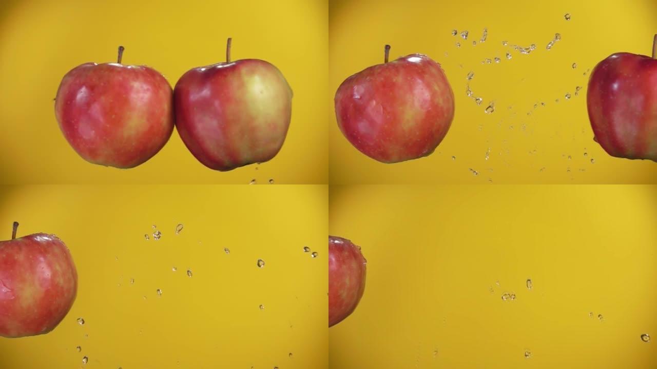 在黄色的背景上，苹果在水花中互相拍打