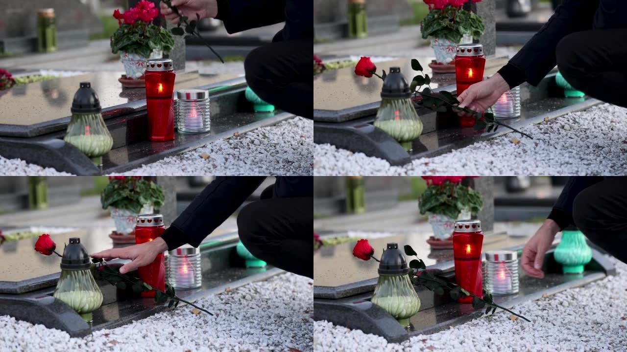 高加索人把花放在坟墓上