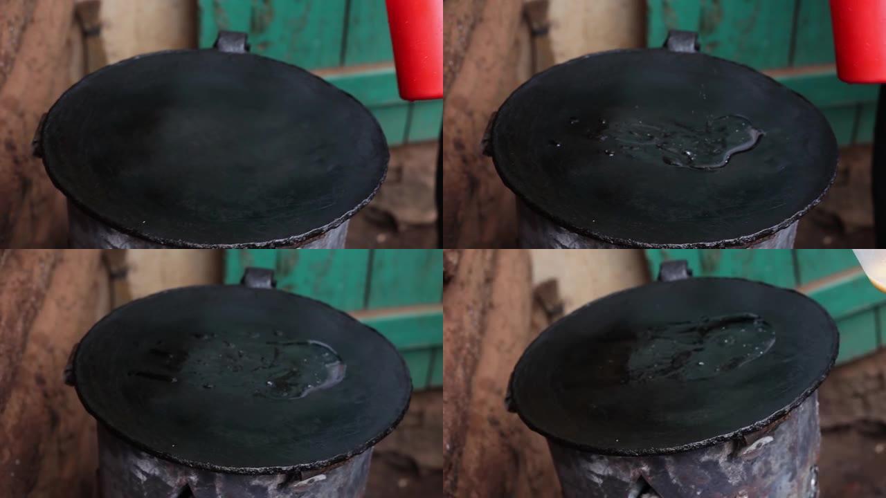 将食用油从锅盖上煮沸后立即从锅盖上放在飞锅上