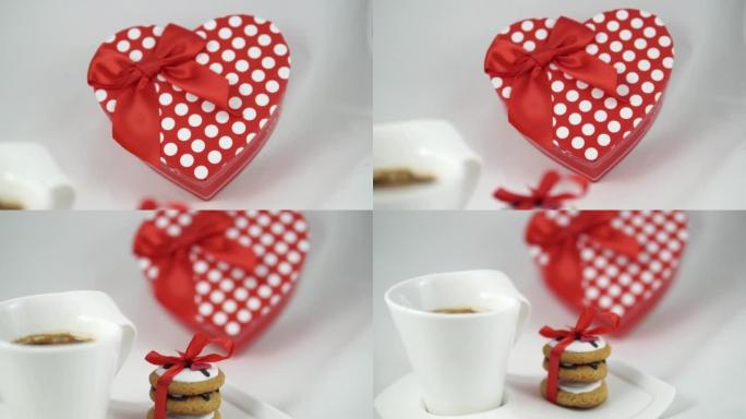 红色浪漫装饰的饼干和一个红色咖啡杯，孤立在白色上。情人节概念