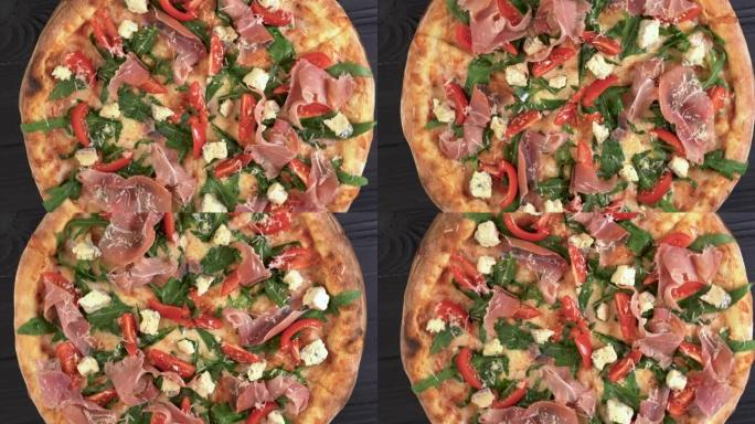 披萨配火腿芝麻菜和帕尔马干酪，背景为深色木质，俯视图。意大利菜。