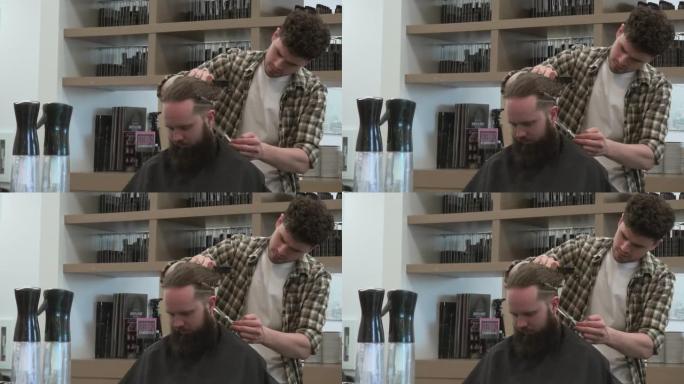 理发师使用剪刀来混合剪裁的发型