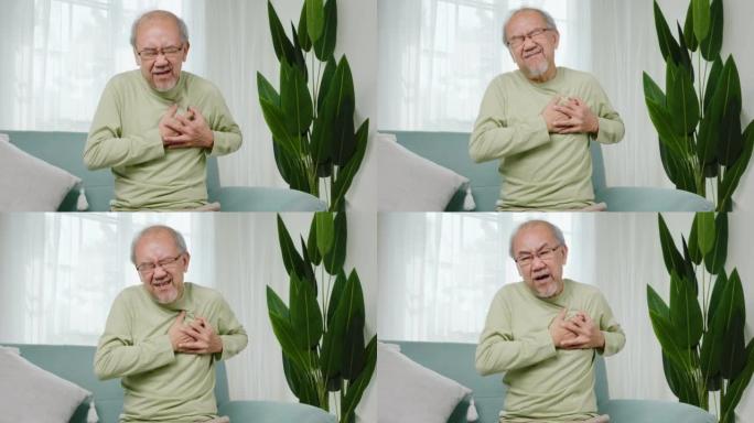 悲伤的老人感到疼痛，用手触摸心脏病发作的胸部