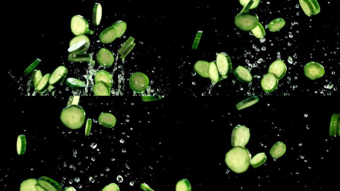 一块块新鲜的黄瓜，水滴飞起，落下。拍摄的是1000 fps的慢动作。
